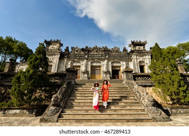 Beautiful  woman with Vietnam culture traditional dress,Ao dai is famous traditional costume ,vintage style,Grand stairs in Imperial Khai Dinh Tomb in Hue ,Vietnam