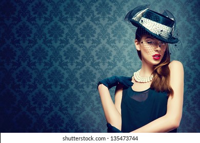 Beautiful Woman In A Vintage Hat Over A Fashion Background