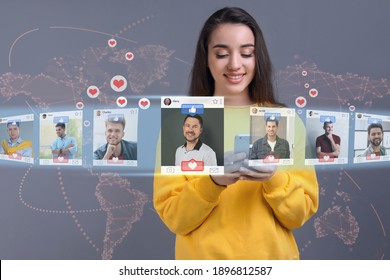 Beautiful woman visiting online dating site via smartphone on color background - Shutterstock ID 1896812587
