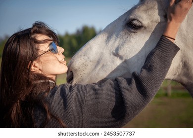 Beautiful woman walking with horse - Powered by Shutterstock