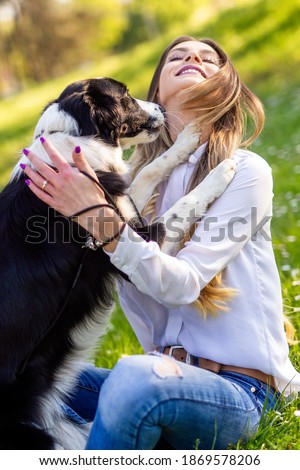 Similar – Happy smiling dog with its pretty young owner