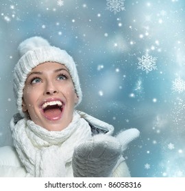 Beautiful Woman In Warm Clothing With Snow