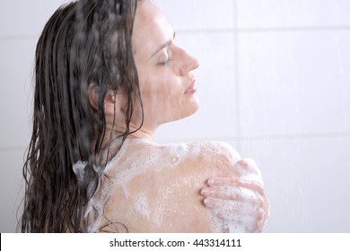 Beautiful Woman Washing Her Body Shower Gel