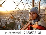 Beautiful woman watching the landscape of Paris, from the Eiffel Tower