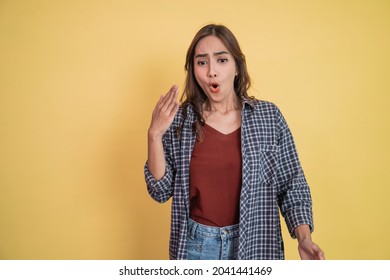 a beautiful woman with waving hand gesture when spiciness with copyspace - Shutterstock ID 2041441469