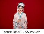 Beautiful woman wearing Chinese Ming Dynasty Hanfu with hairpin and flower ornaments on red background