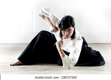 beautiful woman wearing a hakama practicing Aikido