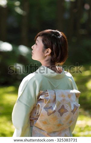 Similar – Foto Bild Frau in roten Kimono malt in blau