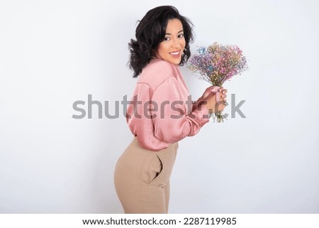 beautiful woman wearing knitted sweater over white background pointing aside with hands open palms showing copy space, presenting advertisement smiling excited happy