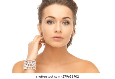 Beautiful Woman Wearing Pearl Earrings And Bracelet