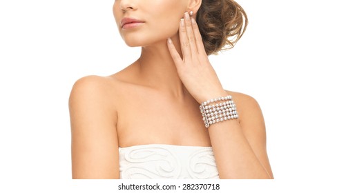 Beautiful Woman Wearing Pearl Earrings And Bracelet