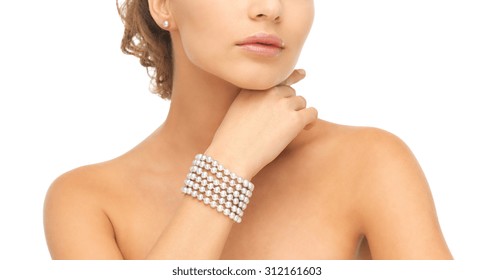 Beautiful Woman Wearing Pearl Earrings And Bracelet