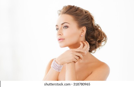 Beautiful Woman Wearing Pearl Earrings And Bracelet