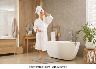 Beautiful woman wearing white robe in bathroom - Shutterstock ID 2158340759