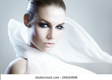 Beautiful Woman Wearing A White Satin Scarf.