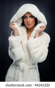 Beautiful Woman In White Fashionable Fur Coat