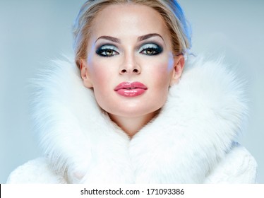 Beautiful Woman In A White Fur Coat