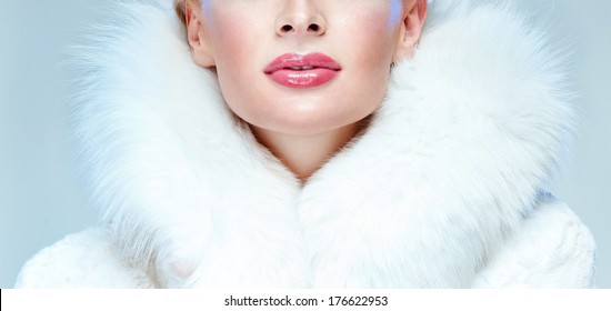 Beautiful Woman In A White Fur Coat