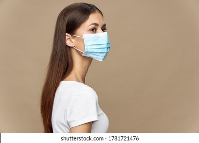 Beautiful Woman In White Shirt In A Medical Mask Health Protection 