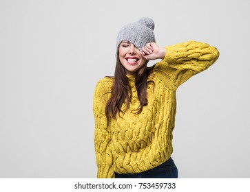 Beautiful Woman Winter Portrait. Smiling Girl Wearing Warm Clothes Having Fun