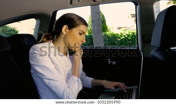 beautiful woman at work in\
car