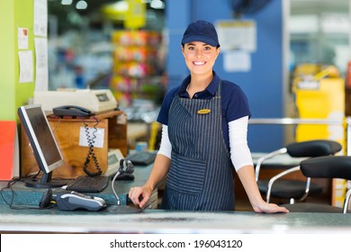 beautiful woman working as a cashier at the supermarket