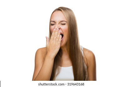 Beautiful Woman Yawns Of Boredom On White Background