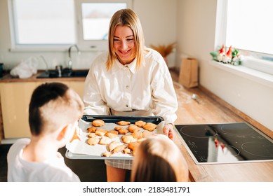 Beautiful Woman Young Mom Holding Tray With Fresh Baked Cookies And Giving A Treat For Kids