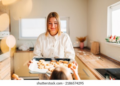 Beautiful Woman Young Mom Holding Tray With Fresh Baked Cookies And Giving A Treat For Kids