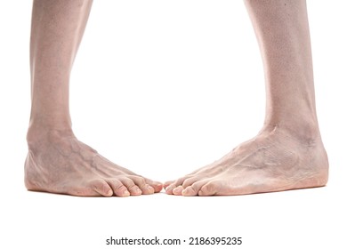Beautiful Woman's Bare Feet Against A White Background.