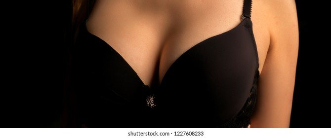 Beautiful Woman's Breasts In Bra