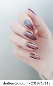 Beautiful woman's hand with long nails and multicolored nail polish - Shutterstock ID 2318718113