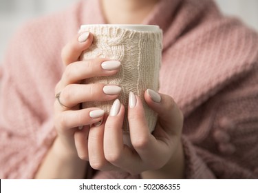 beautiful woman's hands with a cup