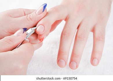 Beautiful Woman's Hands Are Doing The Male Manicure