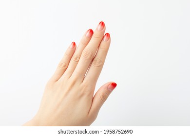 Beautiful woman's hands and nail art which designed gradient red color