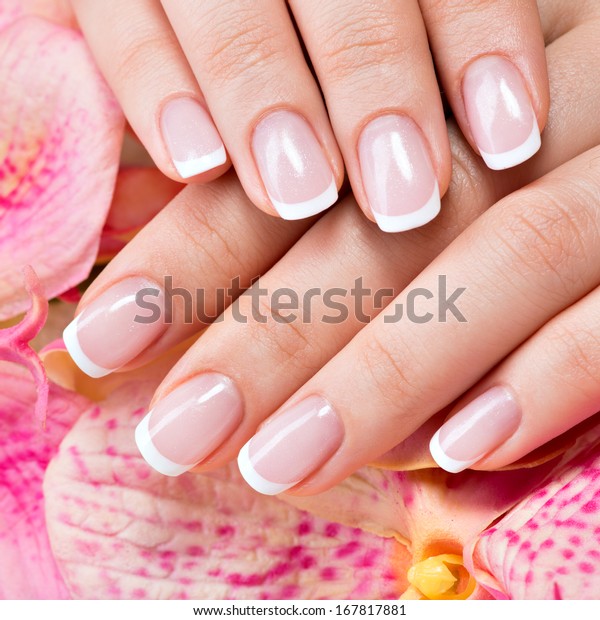 Beautiful\
woman\'s nails with beautiful french manicure \
