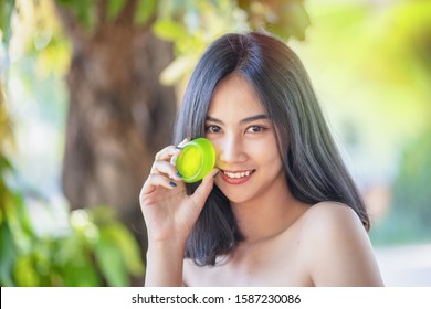 Beautiful Women Bath Using Soap That Contains Natural Ingredients.Young Woman Using Bar Of Natural Soap.