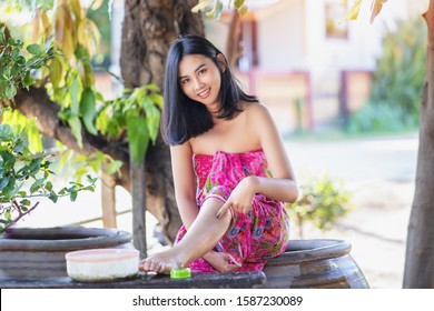 Beautiful Women Bath Using Soap That Contains Natural Ingredients.Young Woman Using Bar Of Natural Soap.