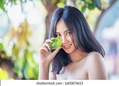 Beautiful Women Bath Using Soap That Contains Natural Ingredients.Young Woman Using Bar Of Natural Soap.