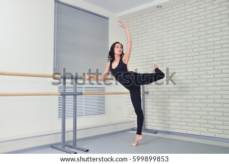 Beautiful women dancer practicing ballet at dancing studio