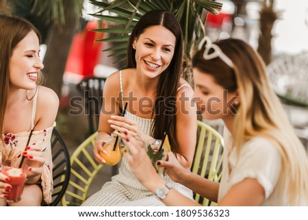 Similar – Woman holding lemonade glass and friends cooking in barbecue