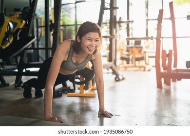 beautiful women exercise push up in the gym, sport fitness concept