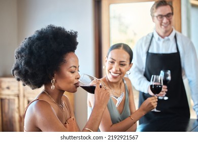 Beautiful Women Friends Taste A Red Wine Glass Together For Brunch Party In A Luxury Restaurant. Happy Woman With An Afro Drinking With Her Friend At A Distillery Restaurant For Alcohol With A Smile