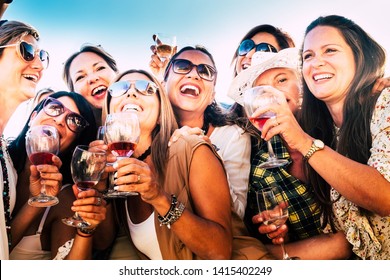 Beautiful Women In Group Celebrate The Friendship  With Some Wine Glass. Nine Caucasian People Enjoying The Sunset With Aperitif