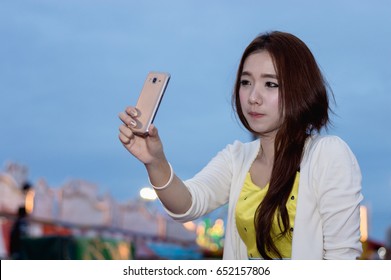 Beautiful Women Are Happy In The Amusement Park.