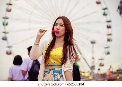 Beautiful Women Are Happy In The Amusement Park.