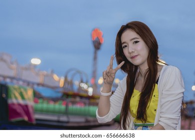 Beautiful Women Are Happy In The Amusement Park.