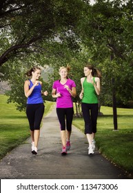 Beautiful Women Jogging Together Outdoors