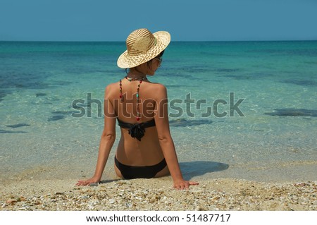 Beautiful women on the beach. Relaxing landscape.