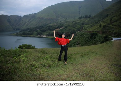 Beautiful Women Pose On The Mount Holbung Lake Toba